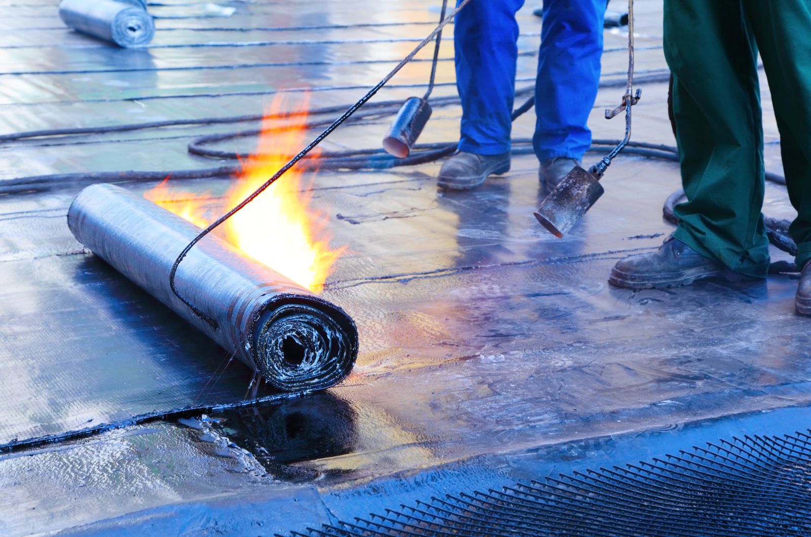 A flat commercial roof under repair